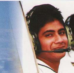 Instructor pointing navigation points to cadet pilot